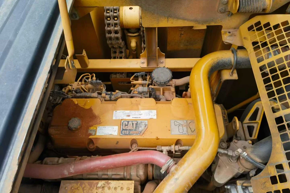 field mechanic reassembling caterpillar c13 engine injectors at jobsite